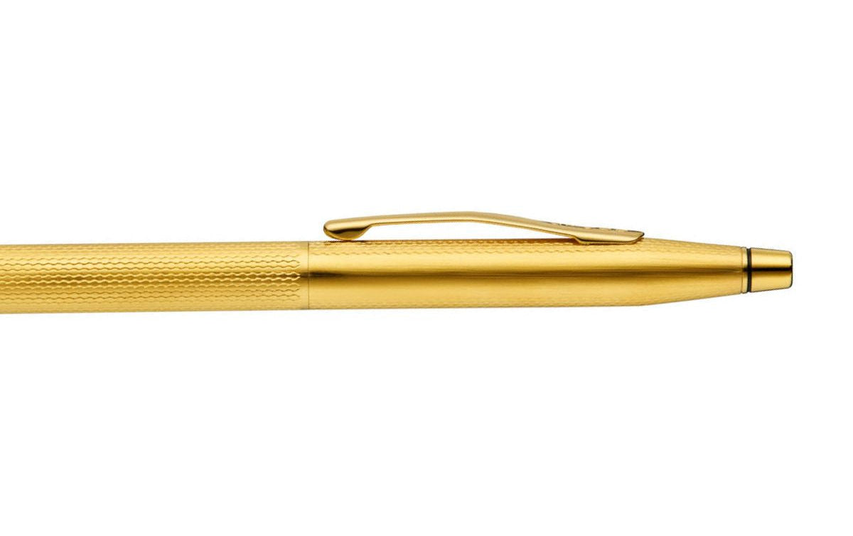Gold pen on a white background